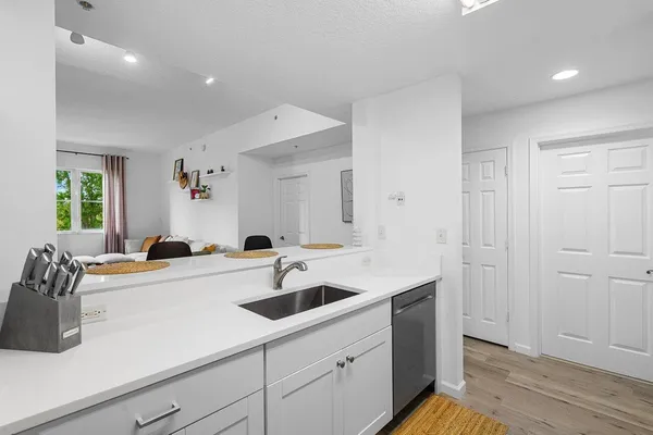 a kitchen with a sink and cabinets