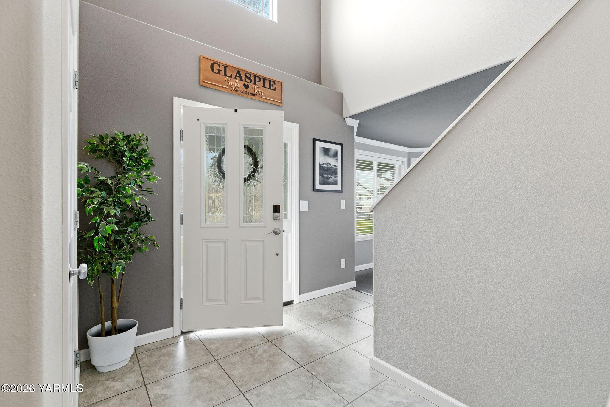 204 Clemans Avenue Moxee, WA 98936 - Photo 2 of 29 a view of a hallway with potted plants