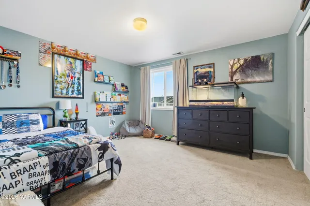 a bedroom with a bed and furniture