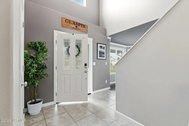 a view of a hallway with potted plants