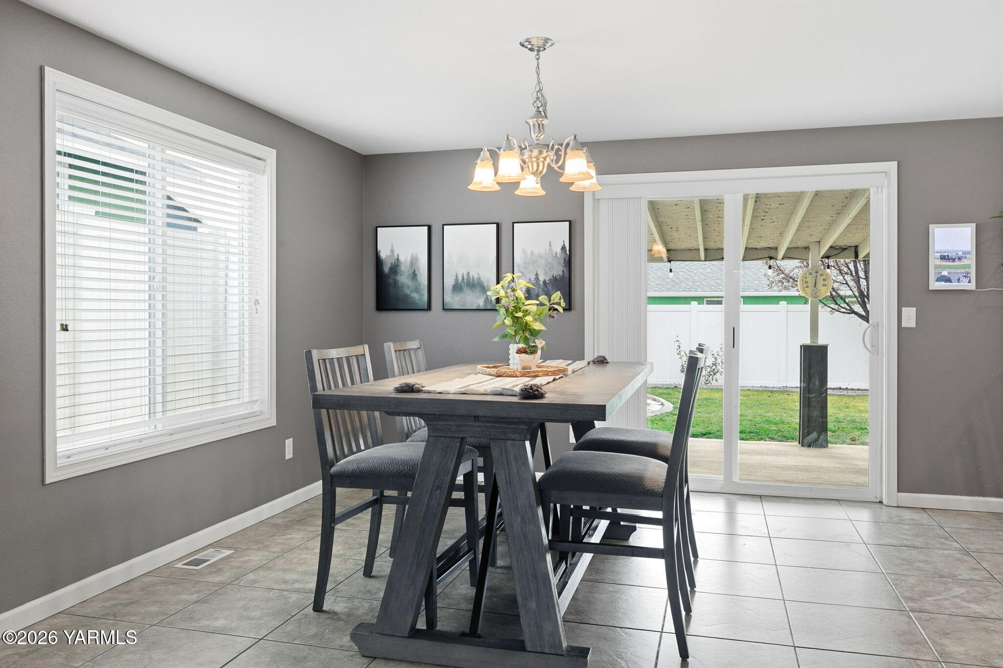 204 Clemans Avenue Moxee, WA 98936 - Photo 7 of 29 a view of a dining room with furniture a chandelier and wooden floor