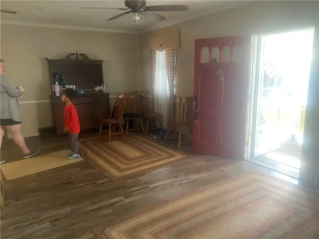 a living room with a couch and a chandelier