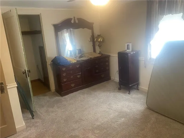 a view of a storage and utility room with a window