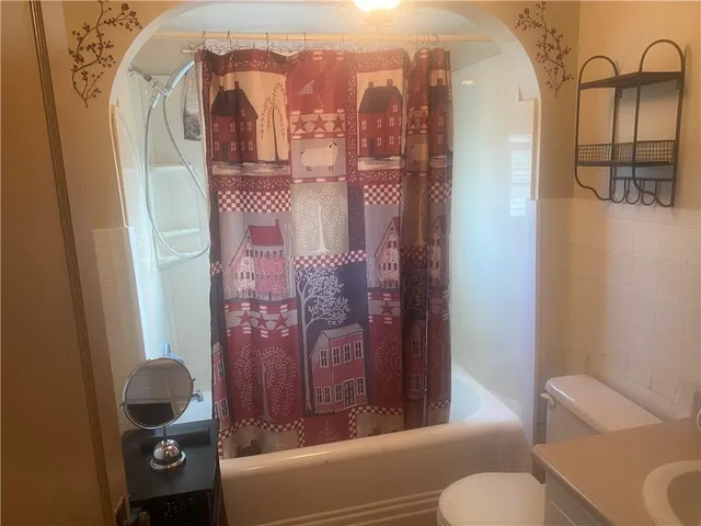 a bathroom with a sink and toilet