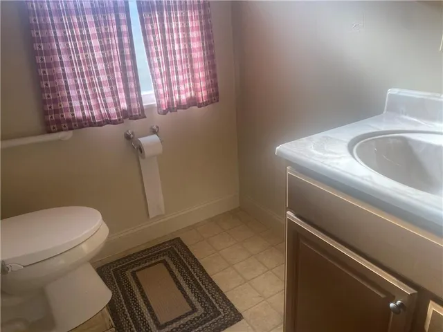 a bathroom with a glass shower door