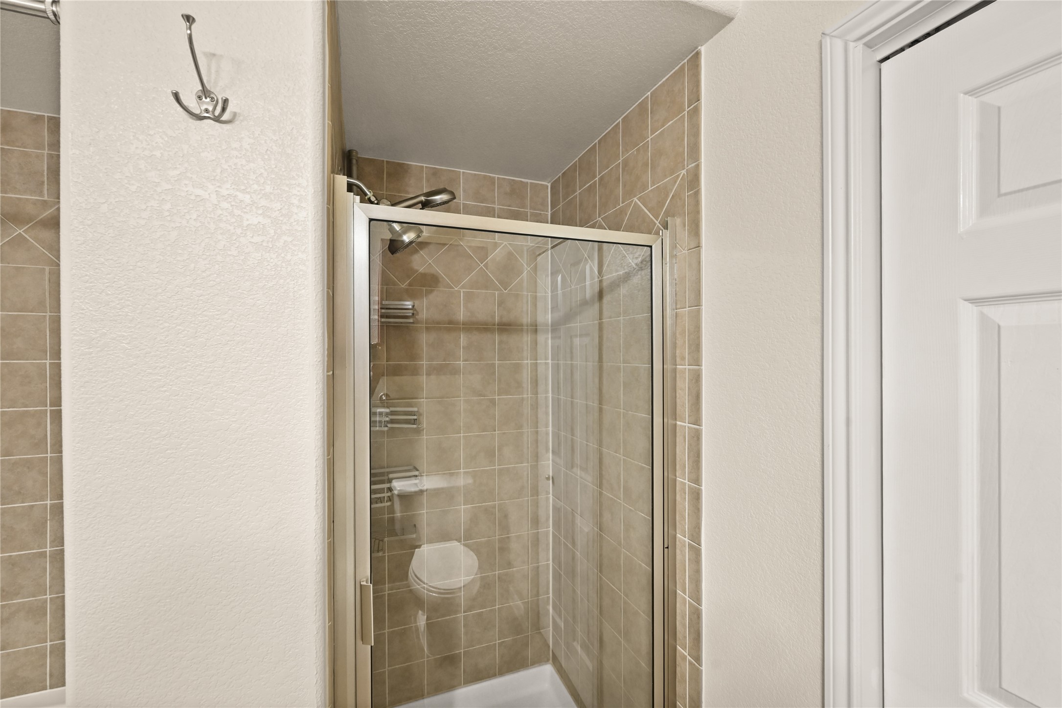 9200 Westheimer Road, Unit 706 Houston, TX 77063 - Photo 21 of 43 a bathroom with a glass door shower