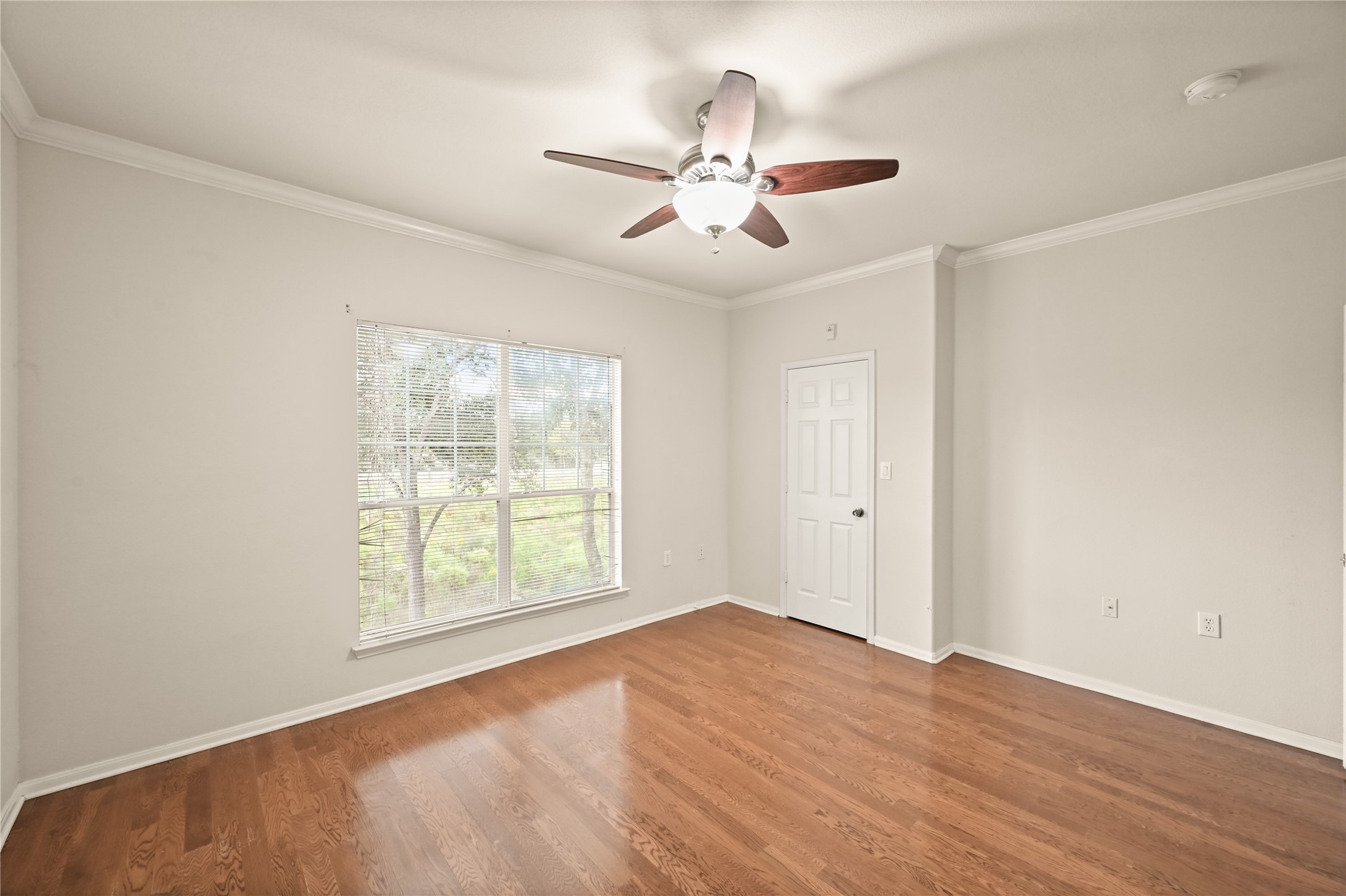 9200 Westheimer Road, Unit 706 Houston, TX 77063 - Photo 25 of 43 wooden floor in an empty room with a window
