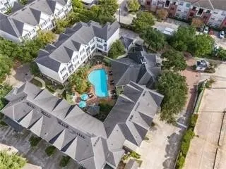 an aerial view of a house with outdoor space