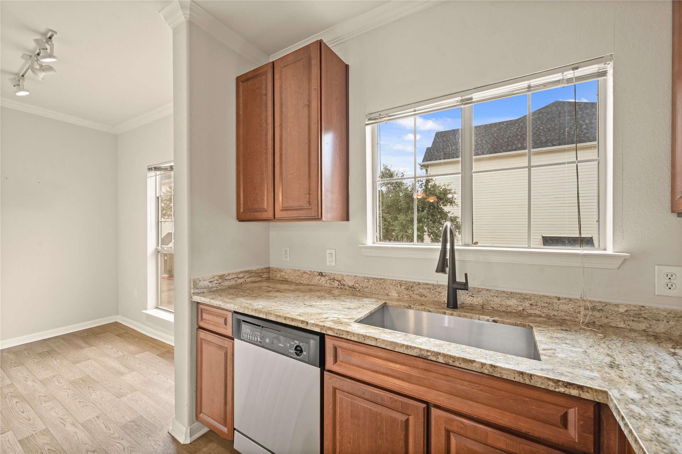 9200 Westheimer Road, Unit 706 Houston, TX 77063 - Photo 8 of 43 a kitchen with a granite countertop sink and window