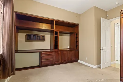 a bathroom with a sink mirror and toilet