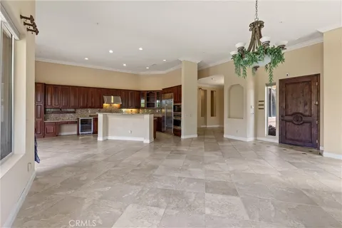 a view of a kitchen with furniture and a potted plant