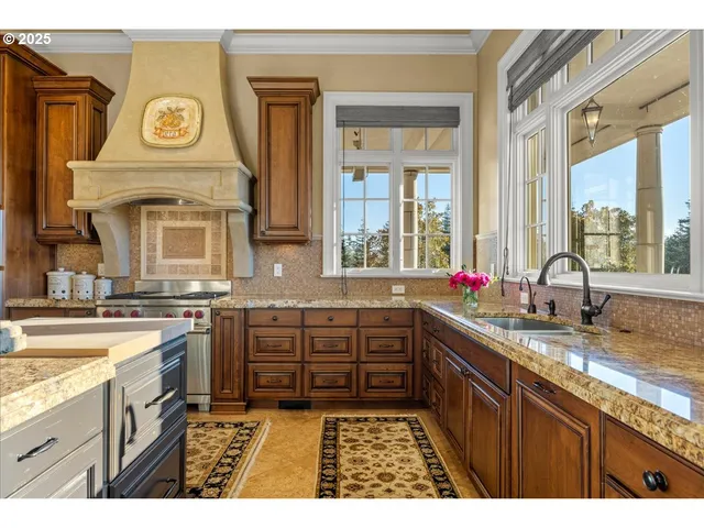 a kitchen with a sink stove and cabinets