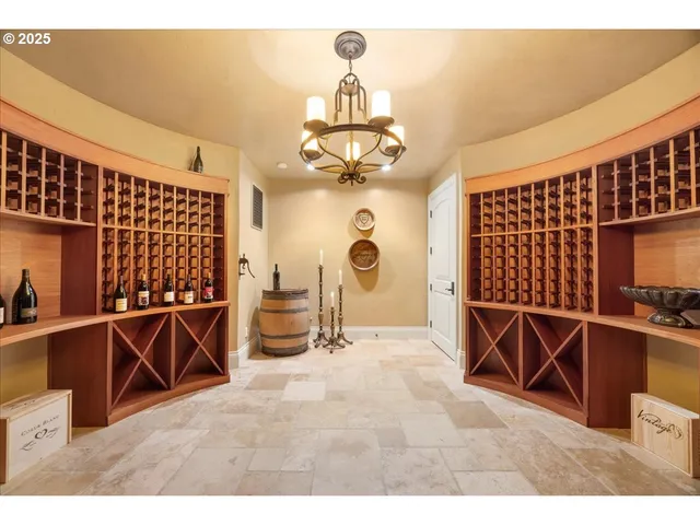 a view of a dining room with furniture and chandelier
