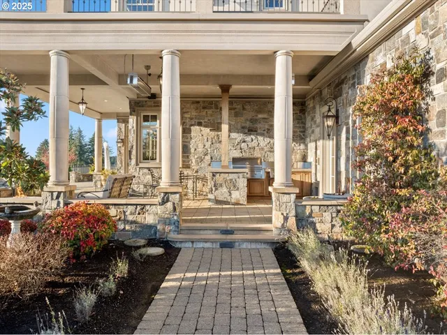 a front view of a house with outdoor seating