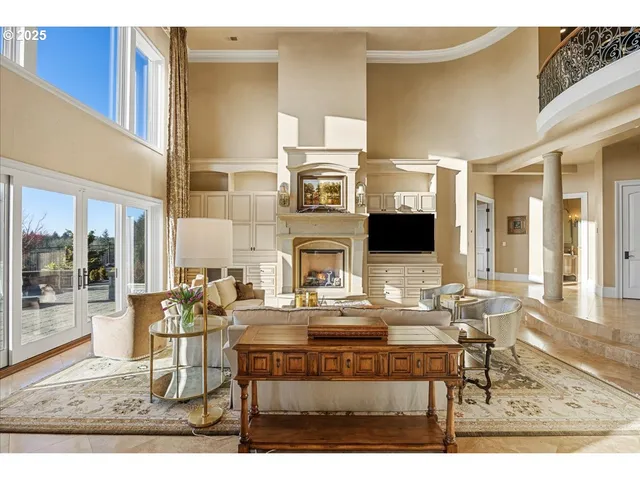a living room with fireplace furniture and a flat screen tv