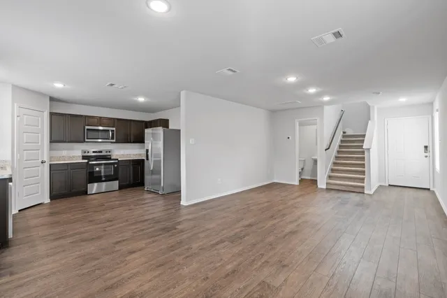 a view of kitchen with wooden floor
