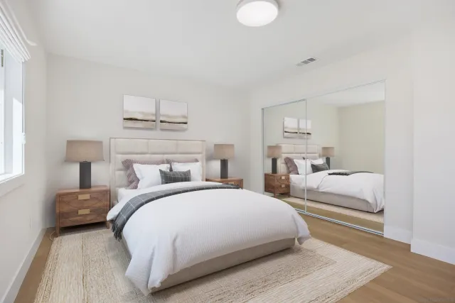 a bedroom with a bed and a couch