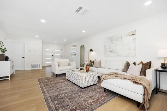 a living room with furniture and a couch
