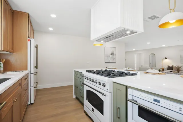 a kitchen with a stove and a sink