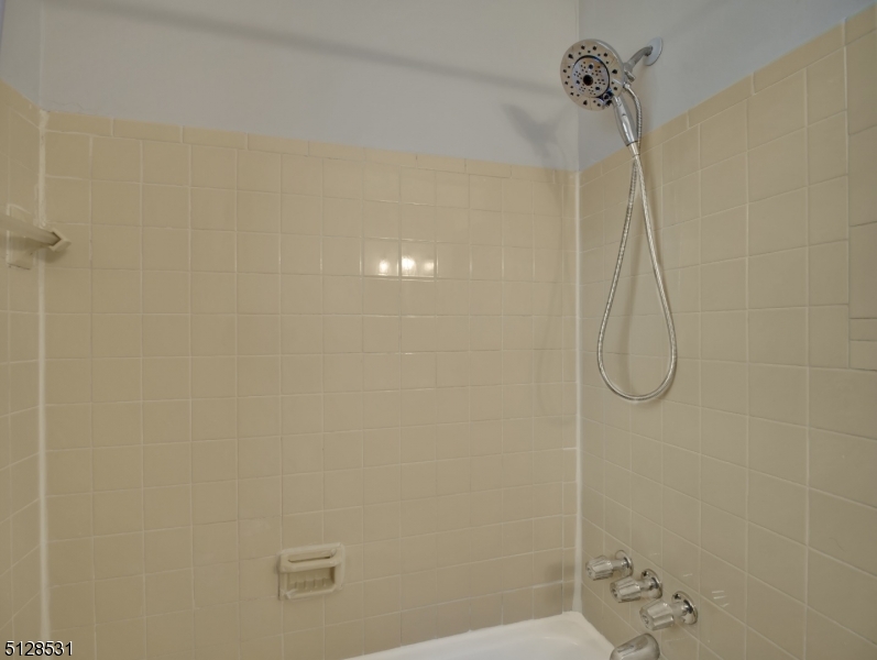 153 Ridge Road, Unit D Cedar Grove, NJ 07009 - Photo 15 of 21 a bathroom with a shower