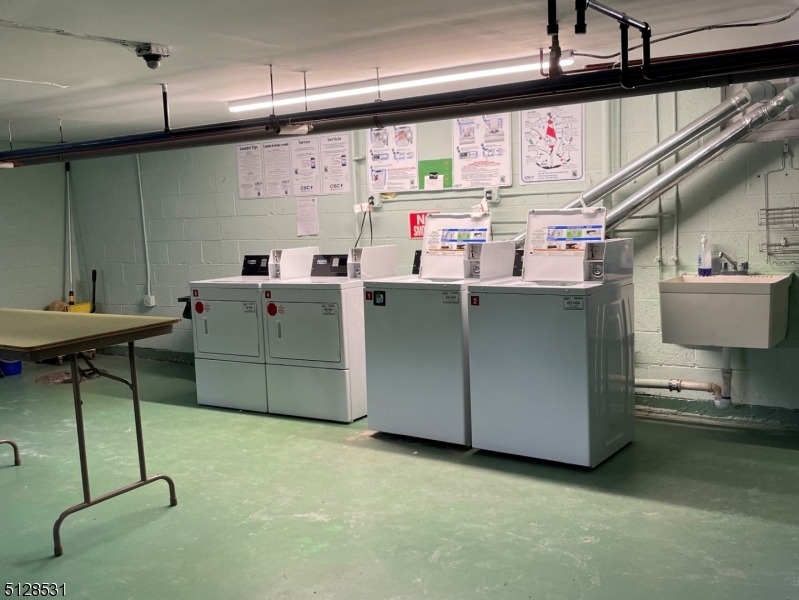 153 Ridge Road, Unit D Cedar Grove, NJ 07009 - Photo 19 of 21 a storage room with washer and dryer