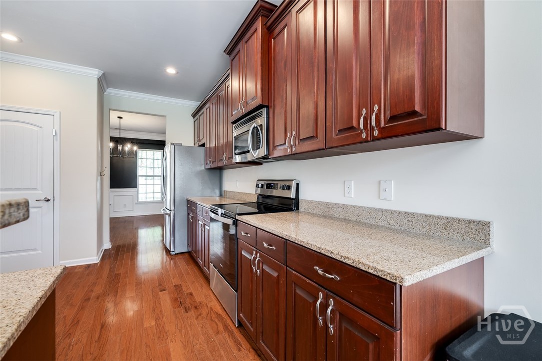 411 Plantation Place Rincon, GA 31326 - Photo 5 of 38 Dining opens to the kitchen. Perfect flow and great for entertaining!