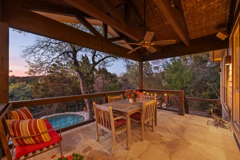 a view of a dining room with furniture water view and a large window