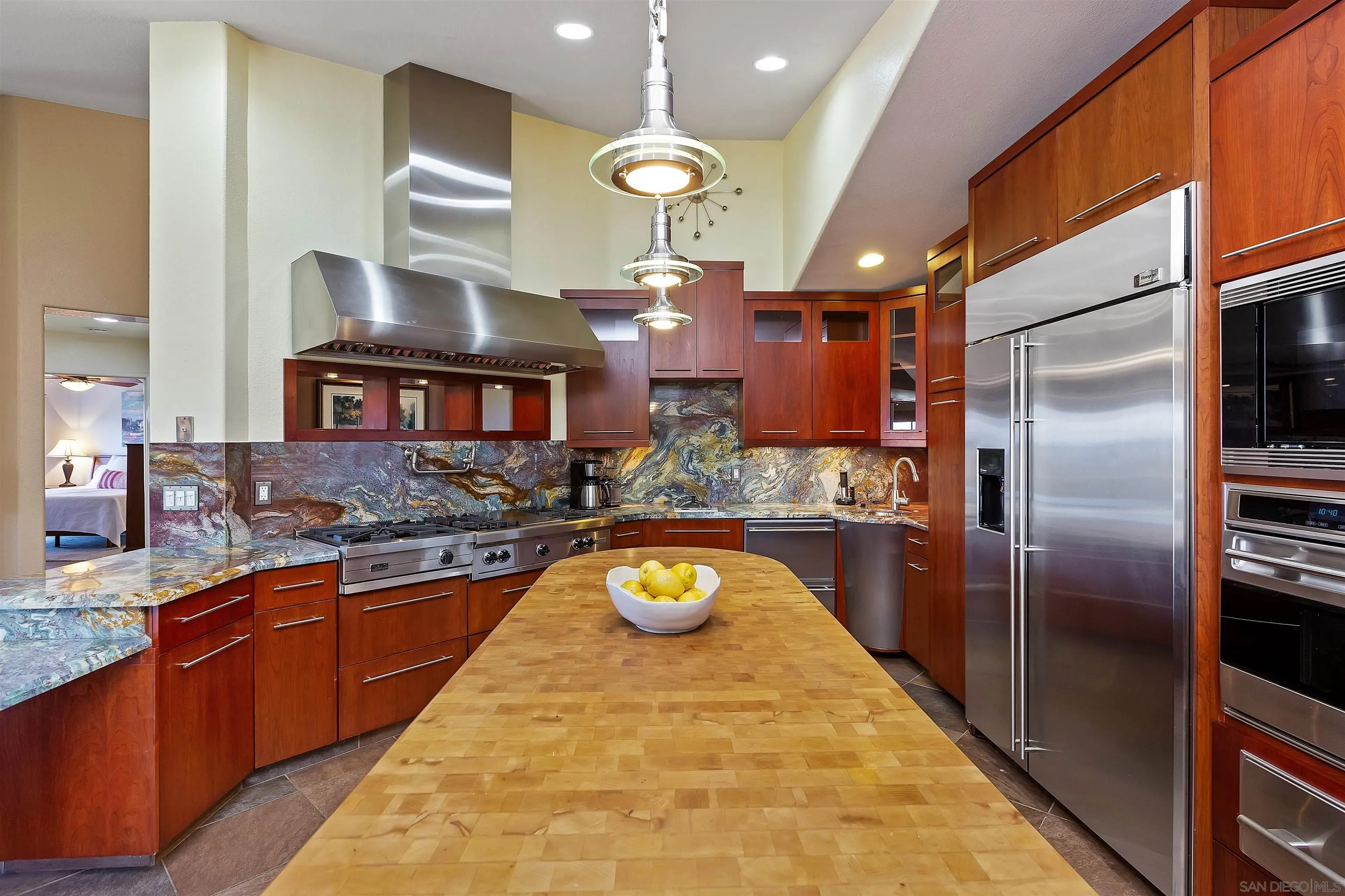 2703 Lobelia Road Alpine, CA 91901 - Photo 13 of 40 a kitchen with stainless steel appliances granite countertop a sink a counter space and stainless steel appliances