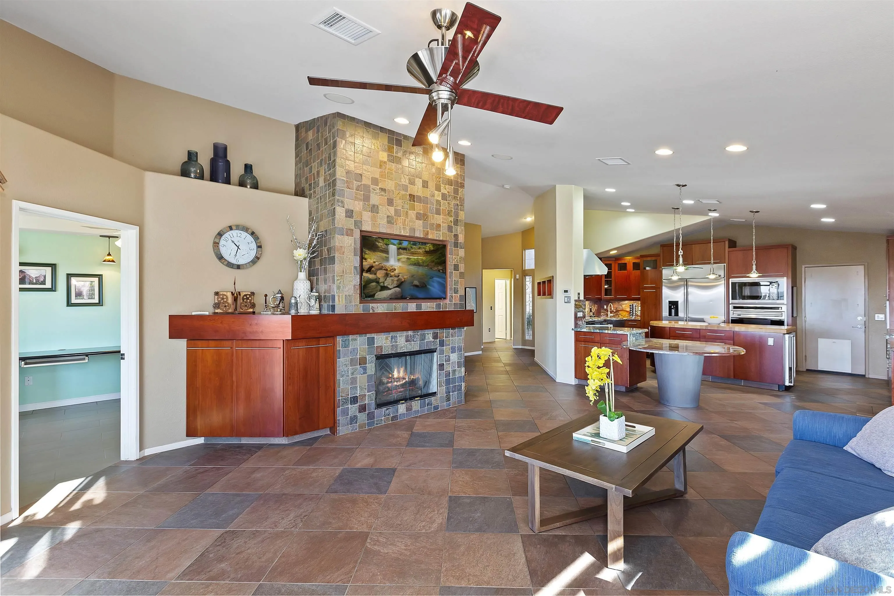 2703 Lobelia Road Alpine, CA 91901 - Photo 16 of 40 a living room with couches and kitchen view with wooden floor
