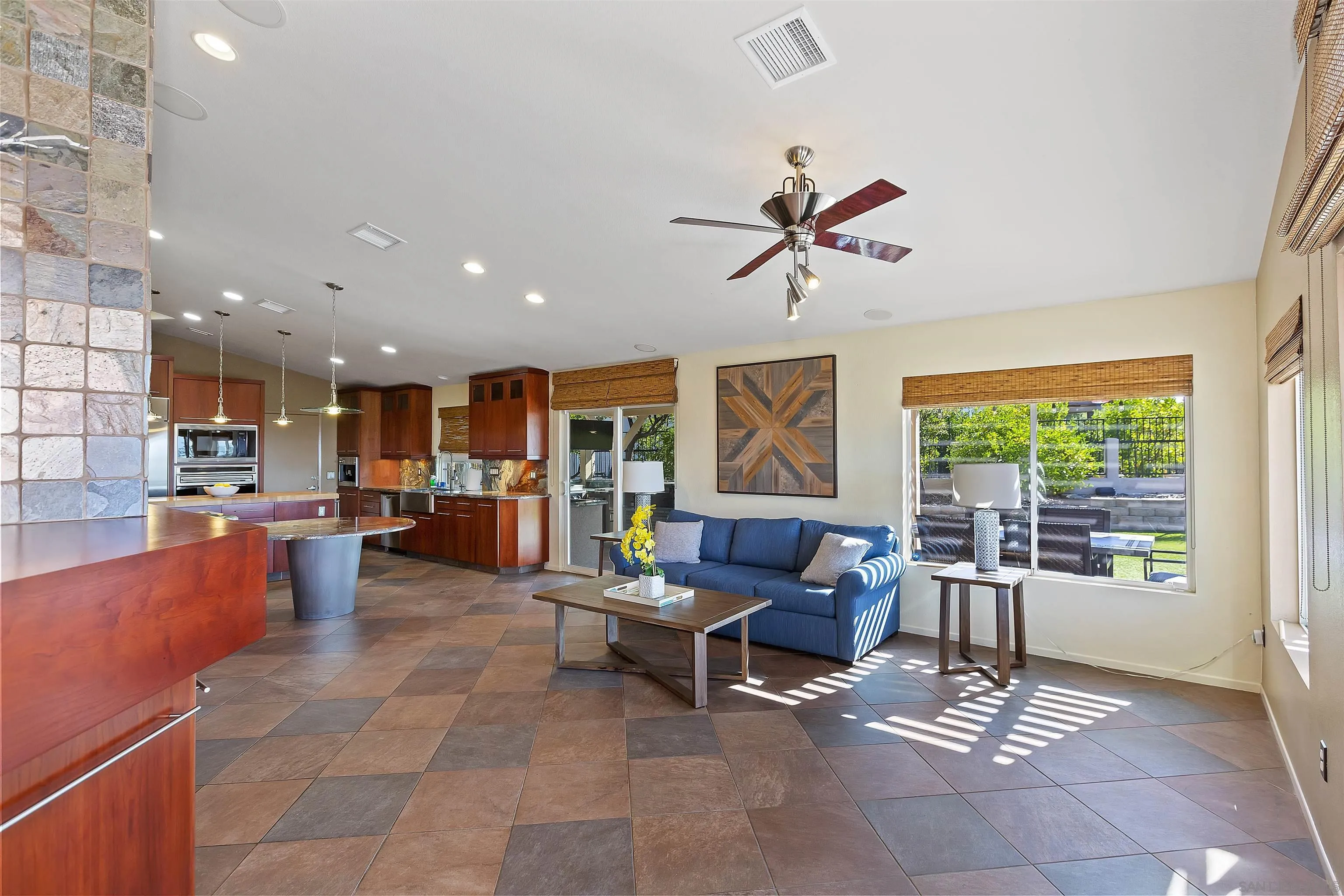 2703 Lobelia Road Alpine, CA 91901 - Photo 17 of 40 a living room with furniture a ceiling fan and a view of kitchen