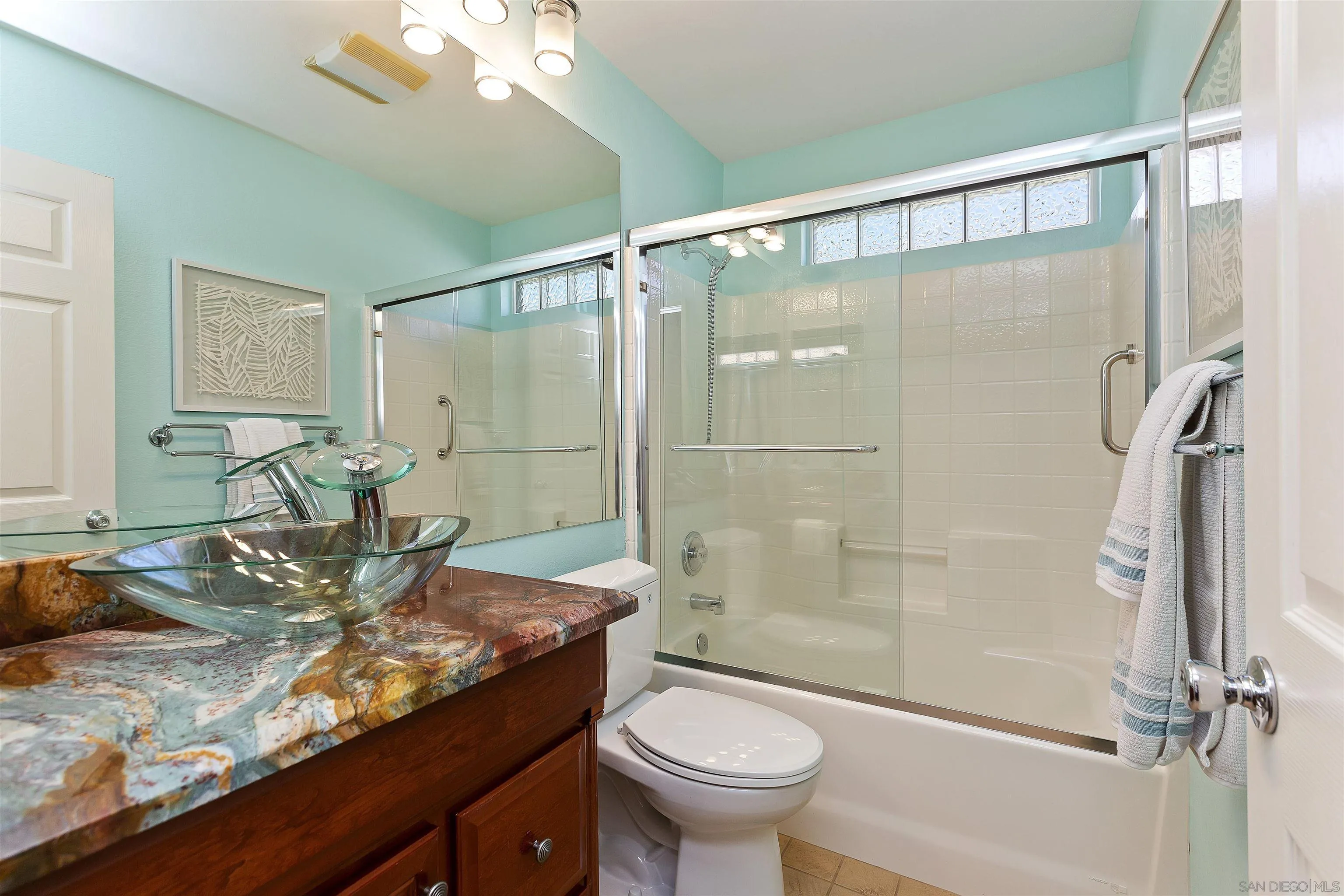 2703 Lobelia Road Alpine, CA 91901 - Photo 24 of 40 a bathroom with a granite countertop sink toilet and shower