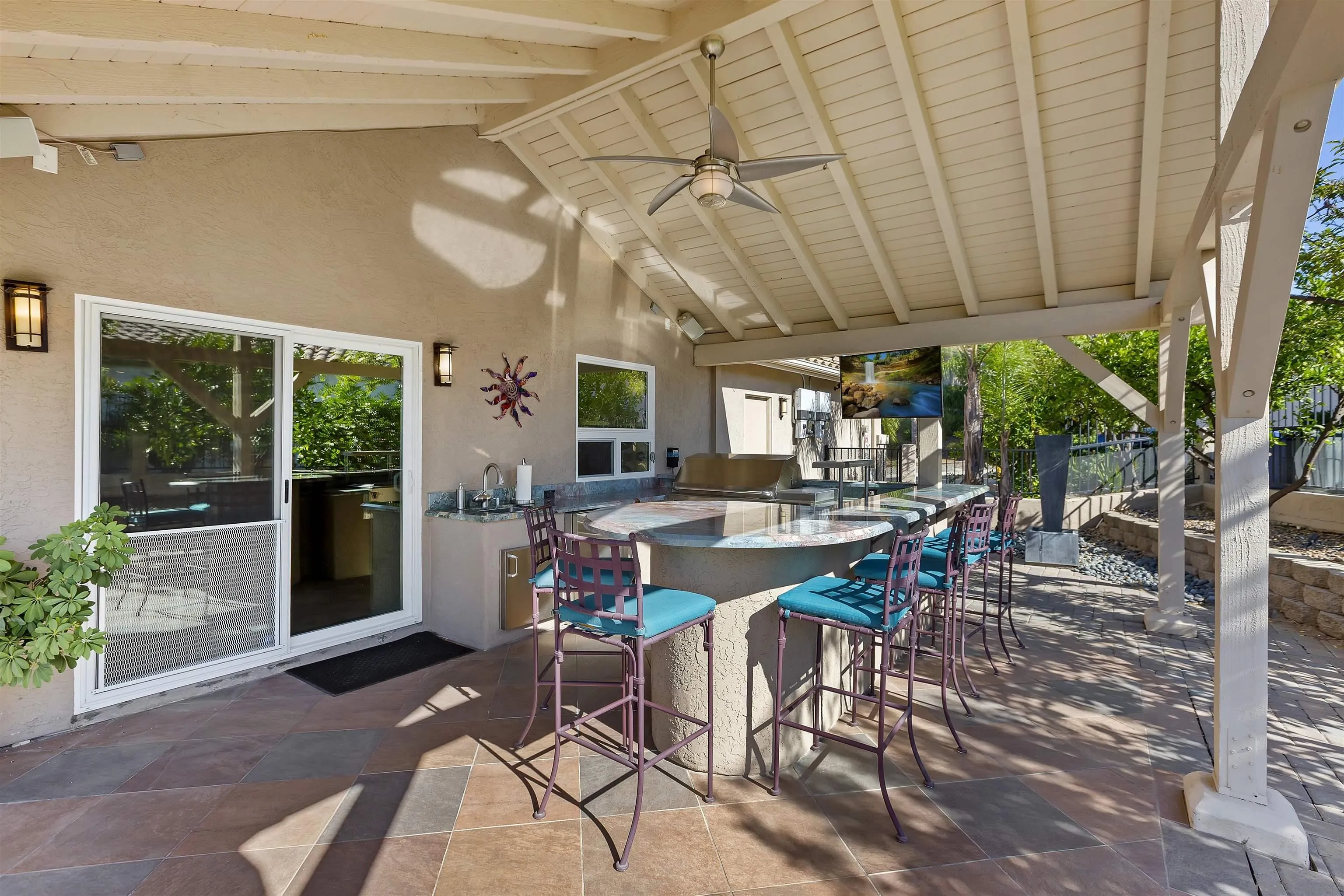 2703 Lobelia Road Alpine, CA 91901 - Photo 28 of 40 a view of a patio with table and chairs and potted plants