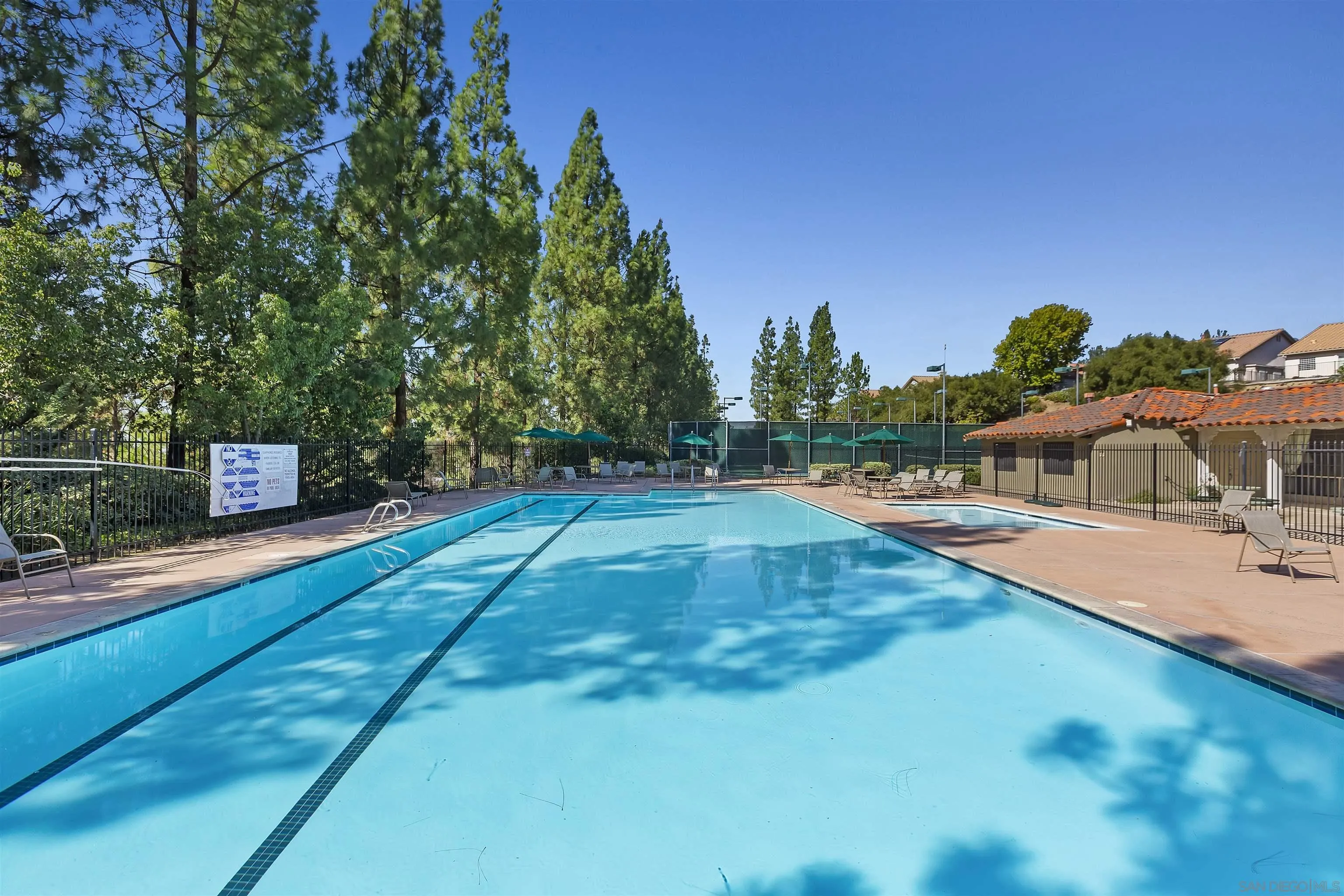 2703 Lobelia Road Alpine, CA 91901 - Photo 39 of 40 a view of a swimming pool with an outdoor seating and a garden