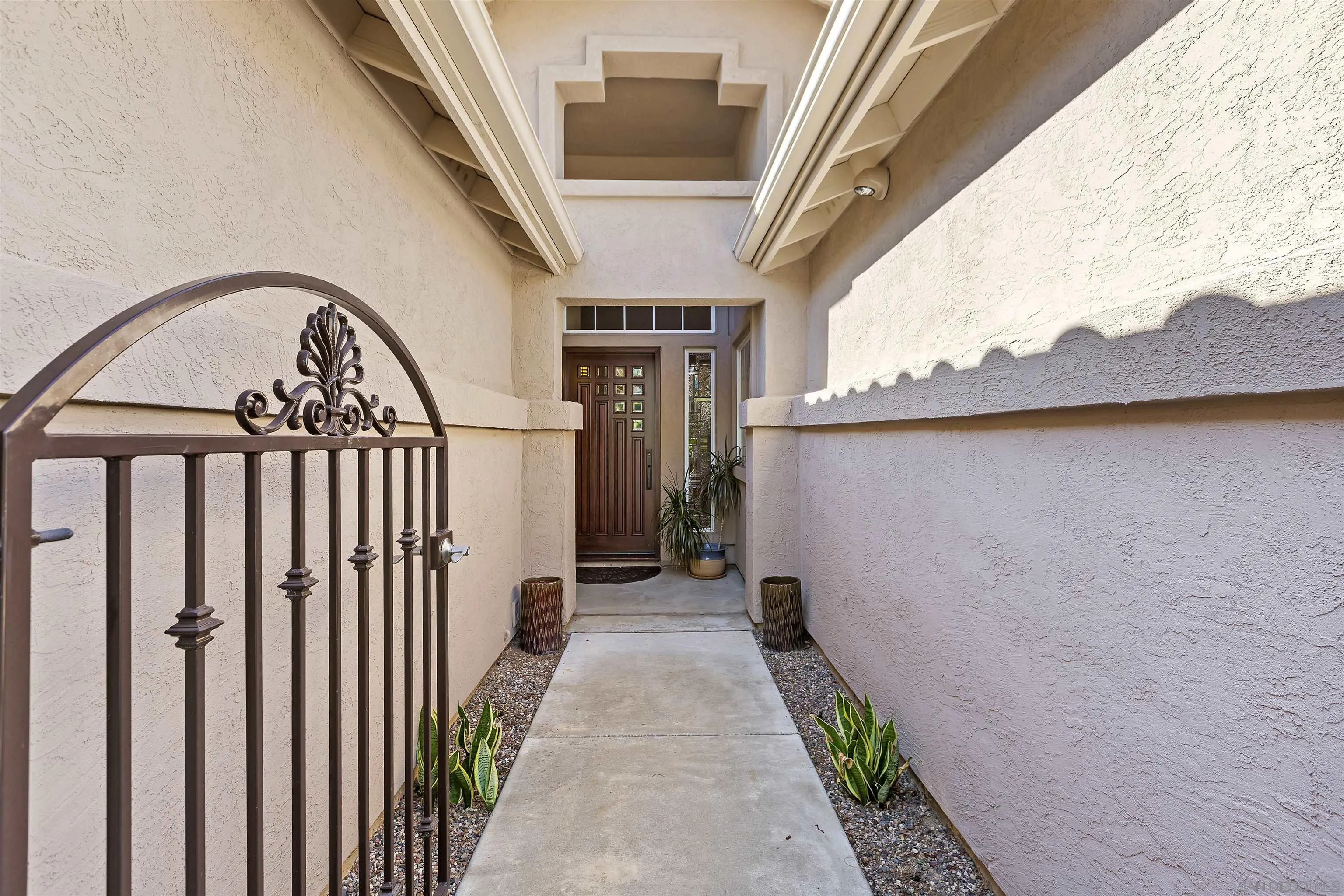 2703 Lobelia Road Alpine, CA 91901 - Photo 5 of 40 a view of a pathway of a house with wooden stairs