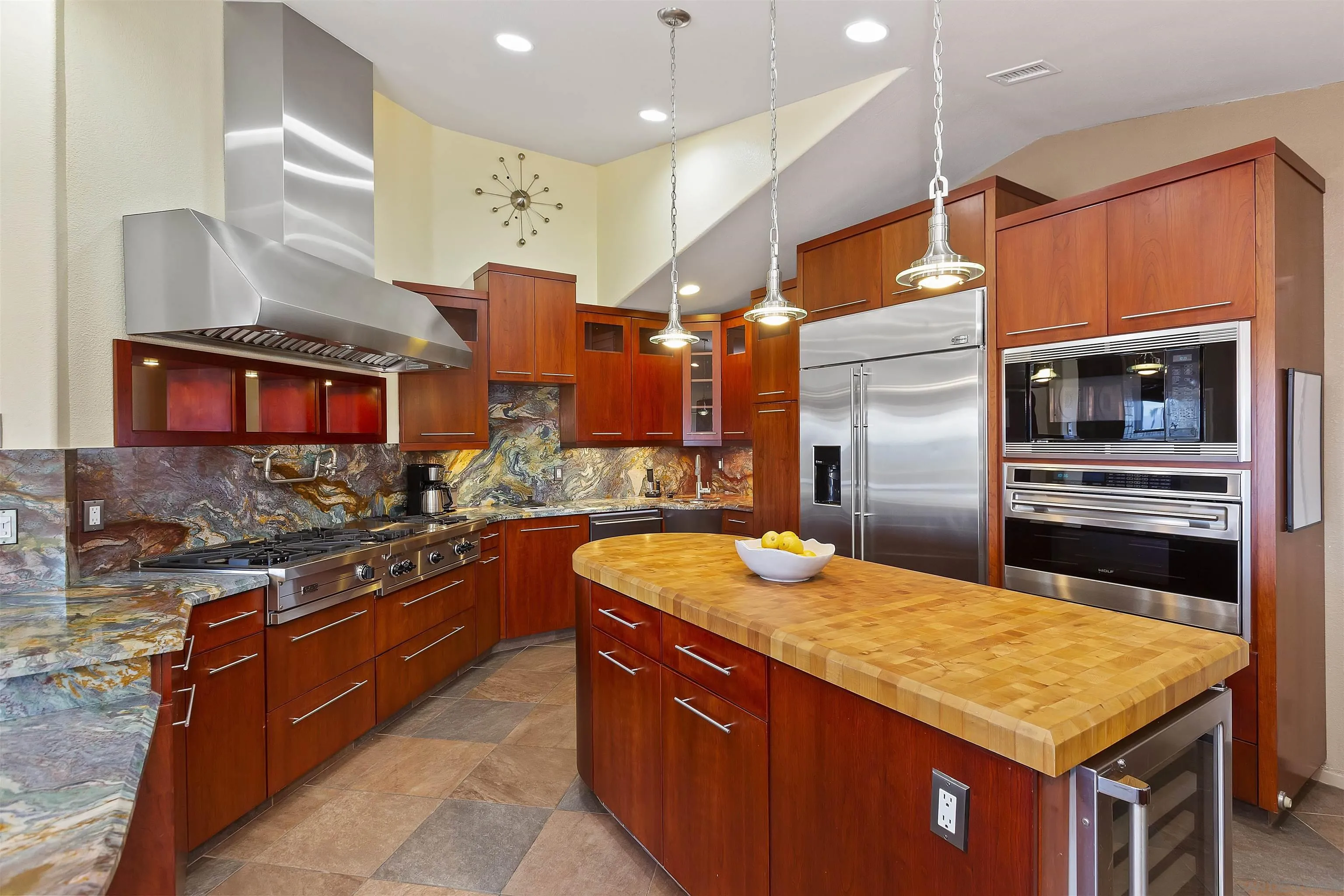 2703 Lobelia Road Alpine, CA 91901 - Photo 8 of 40 a kitchen with stainless steel appliances granite countertop a stove a sink and a refrigerator