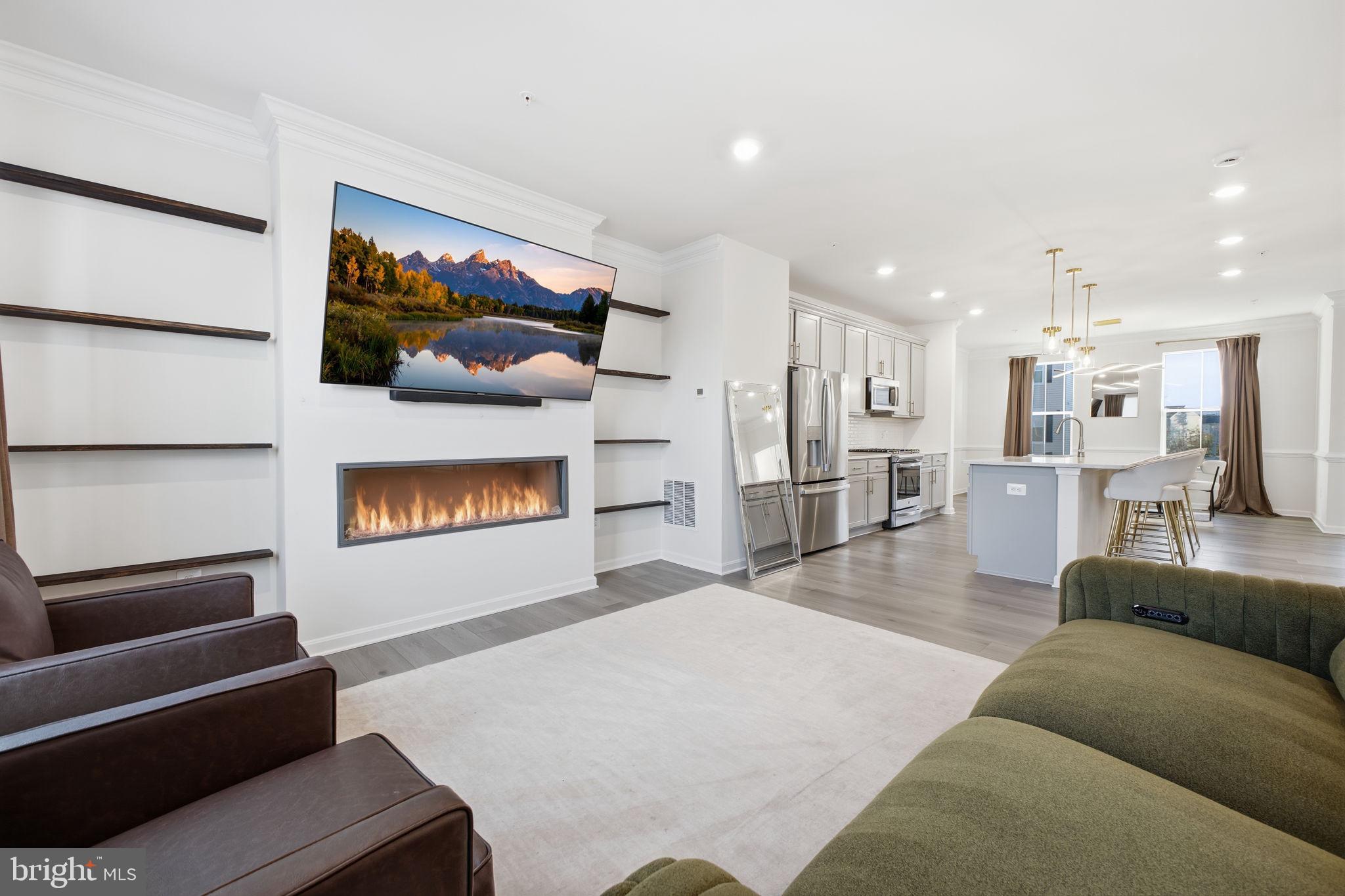 217 Southwind Drive Accokeek, MD 20607 - Photo 12 of 34 a living room with furniture and a flat screen tv