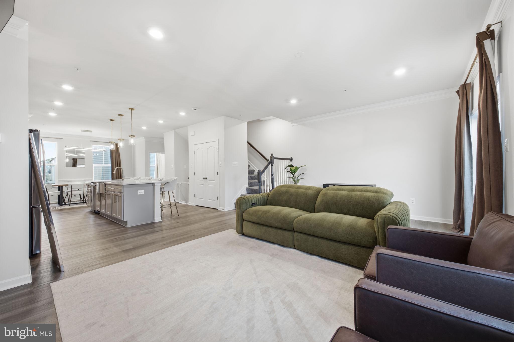 217 Southwind Drive Accokeek, MD 20607 - Photo 13 of 34 a living room with furniture wooden floor and a large window