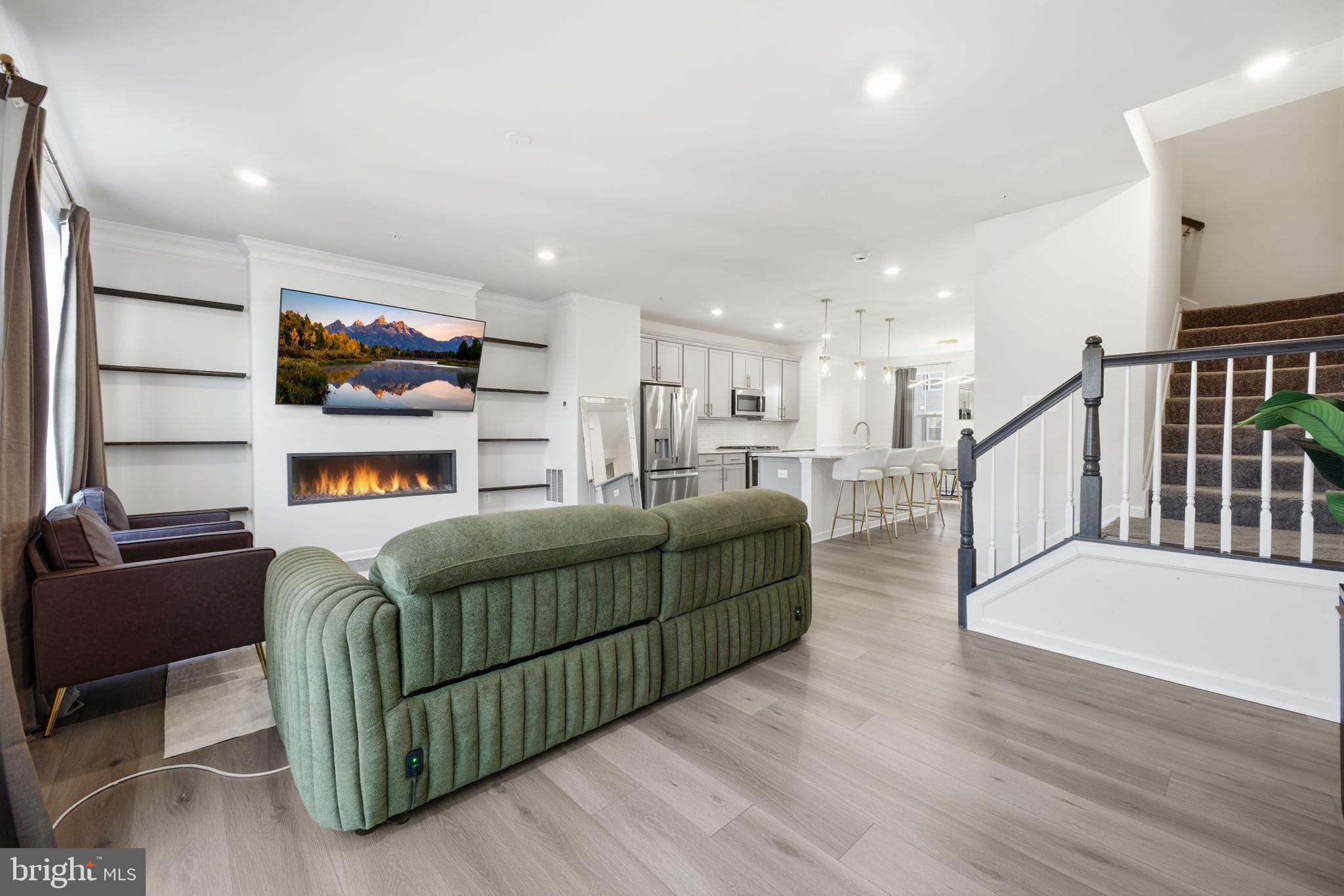 217 Southwind Drive Accokeek, MD 20607 - Photo 14 of 34 a living room with furniture and a flat screen tv
