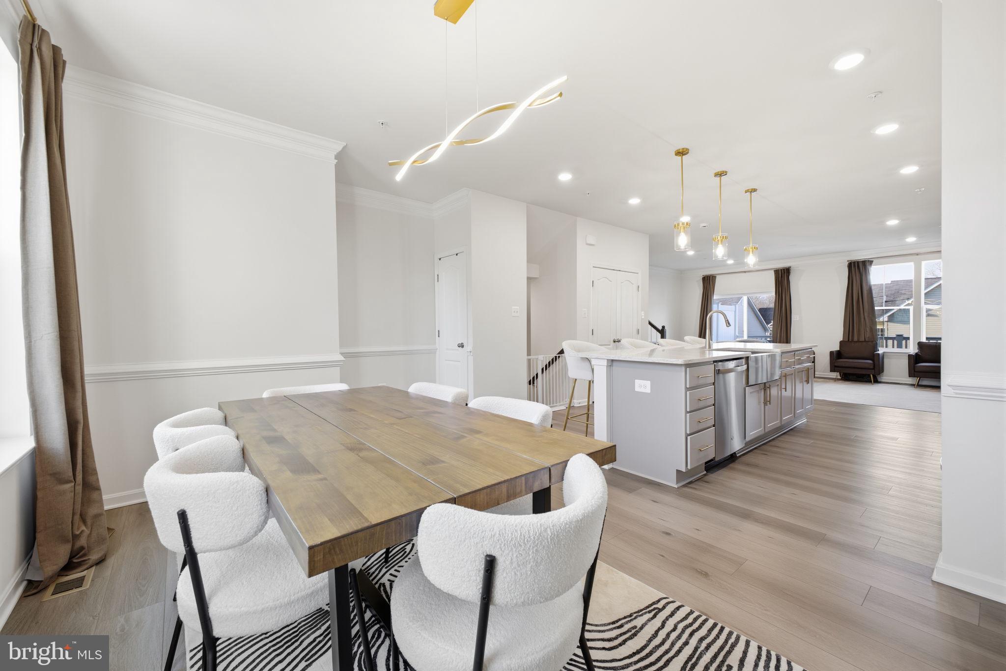 217 Southwind Drive Accokeek, MD 20607 - Photo 15 of 34 a large kitchen with a table and chairs