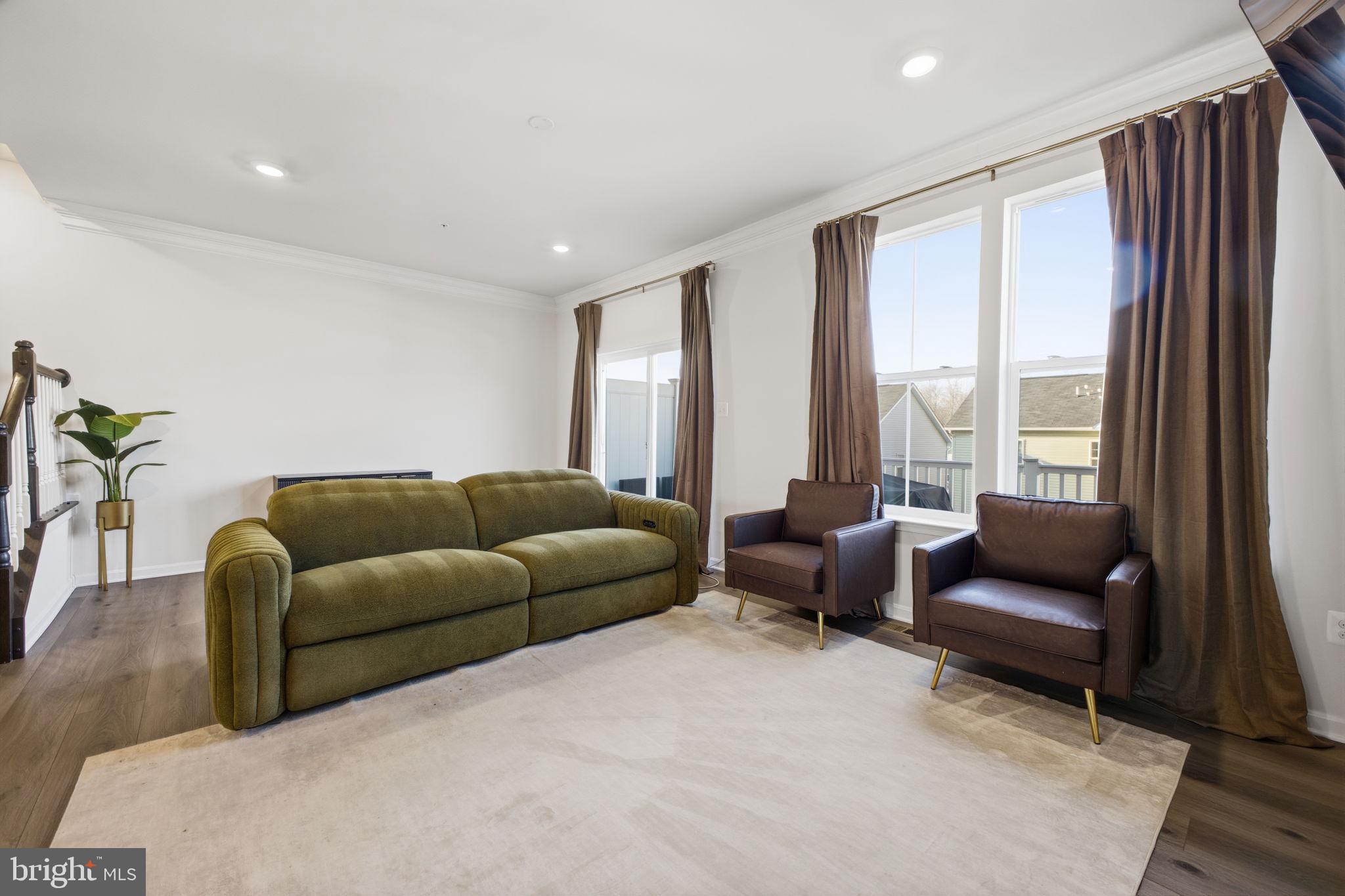 217 Southwind Drive Accokeek, MD 20607 - Photo 16 of 34 a living room with furniture and a large window