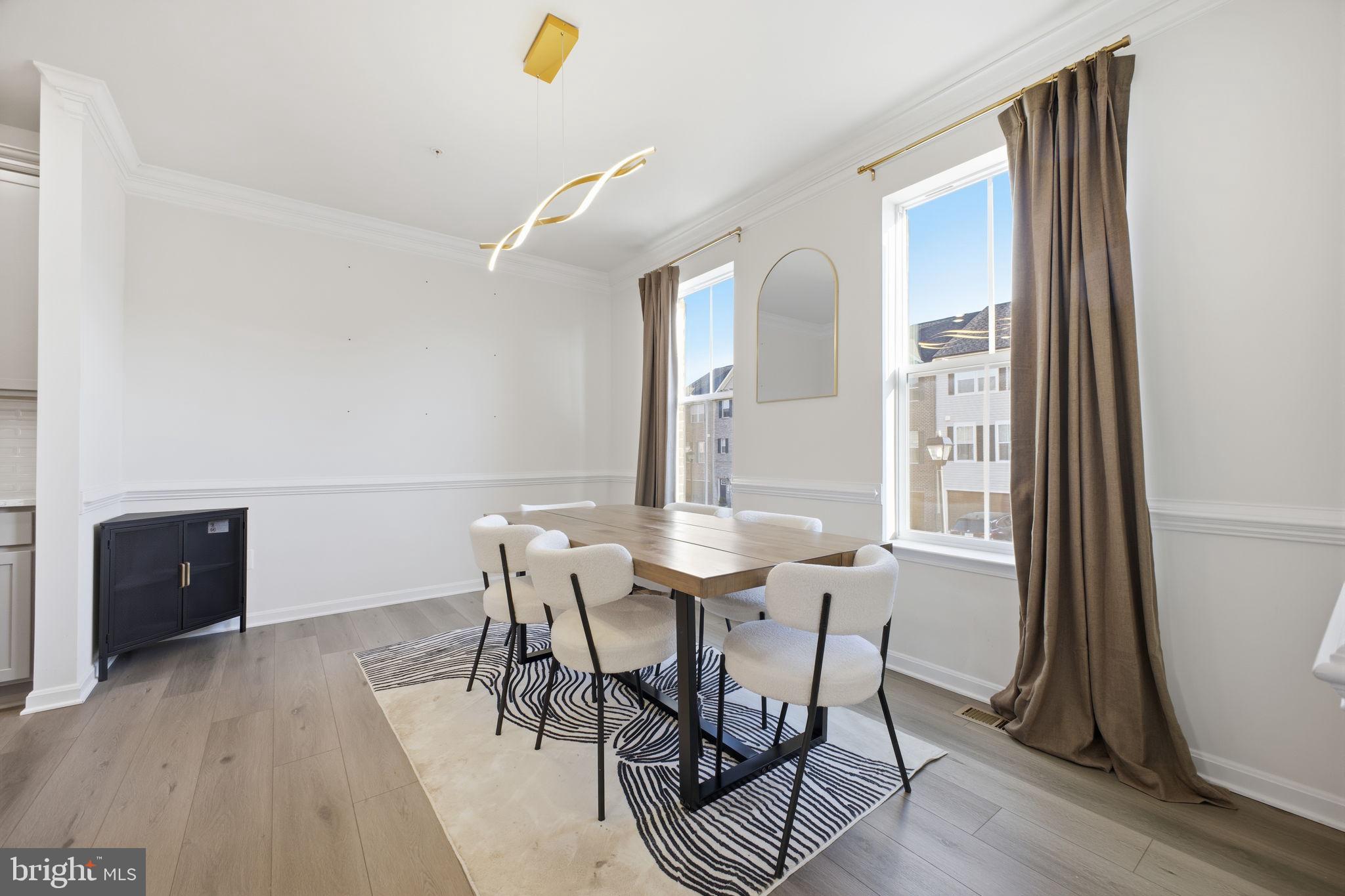 217 Southwind Drive Accokeek, MD 20607 - Photo 22 of 34 a view of a dining room with furniture and wooden floor