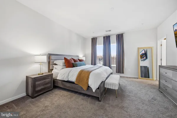 a bedroom with a bed and a walk in closet