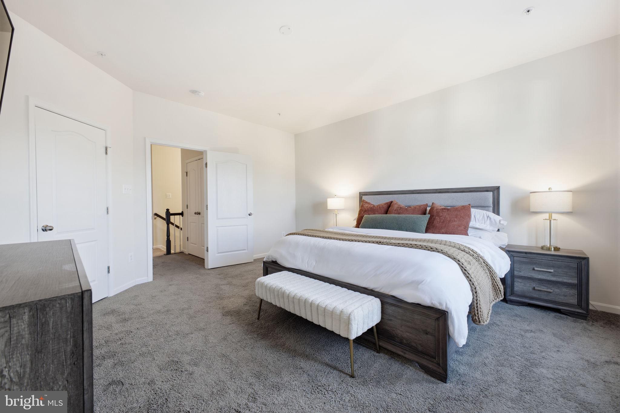 217 Southwind Drive Accokeek, MD 20607 - Photo 25 of 34 a bedroom with a bed and a walk in closet