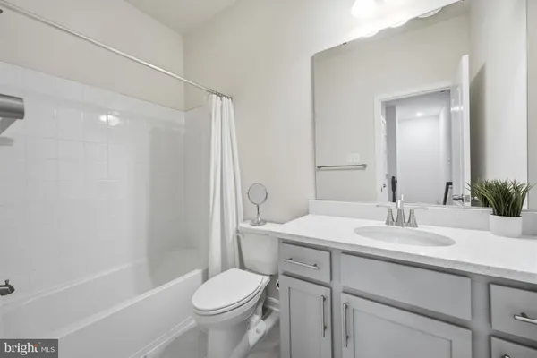 a view of a storage and utility room with washer and dryer