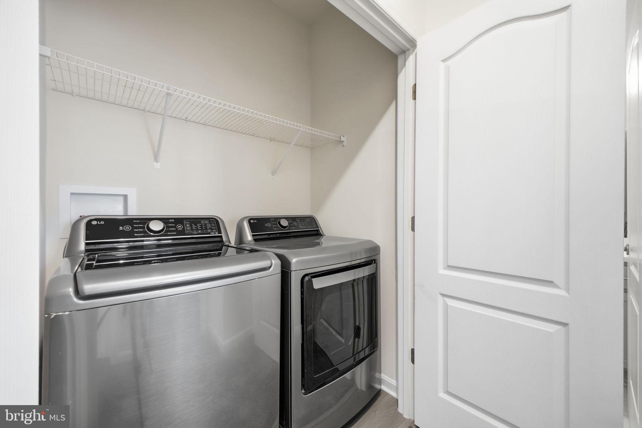217 Southwind Drive Accokeek, MD 20607 - Photo 32 of 34 a view of a storage and utility room with washer and dryer