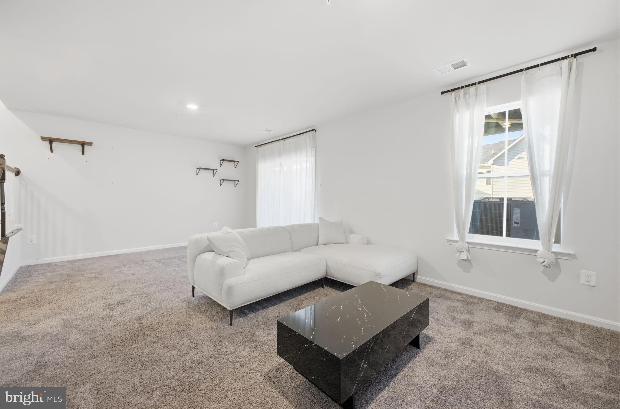 217 Southwind Drive Accokeek, MD 20607 - Photo 5 of 34 a living room with furniture and a window