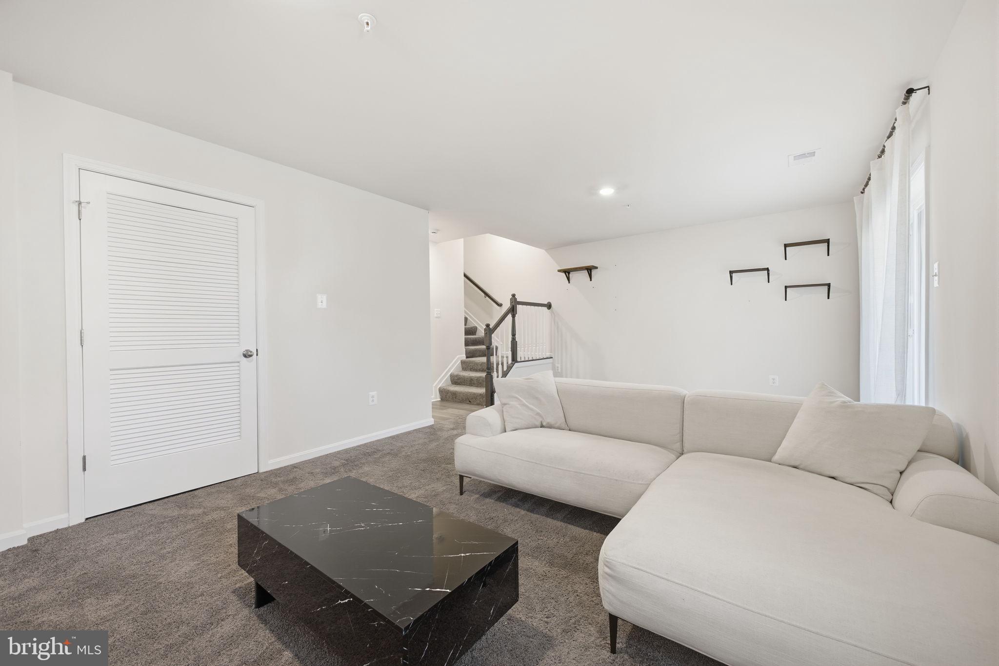 217 Southwind Drive Accokeek, MD 20607 - Photo 6 of 34 a living room with furniture and a couch