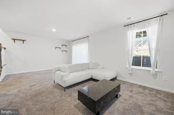 a living room with furniture and a couch