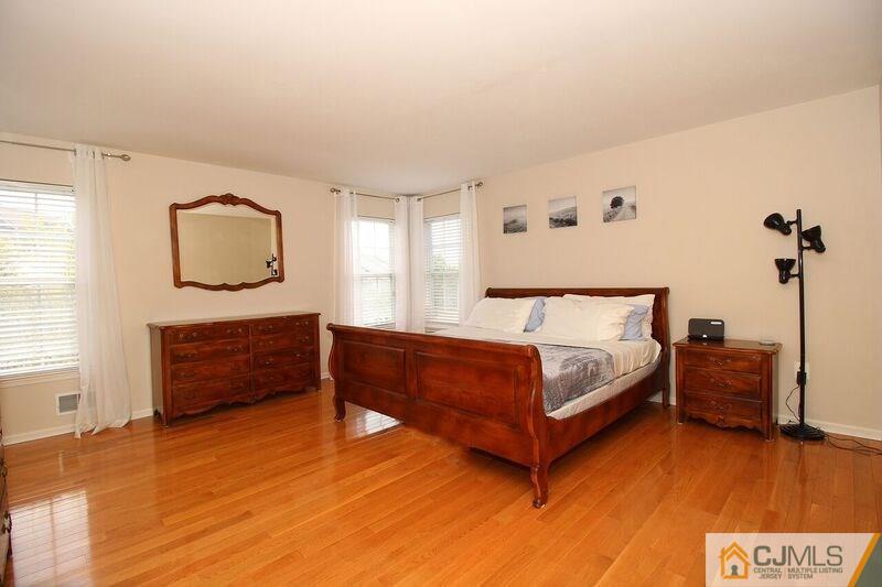 44 Cannon Road Old Bridge, NJ 08857 - Photo 14 of 24 a spacious bedroom with a bed and a dresser