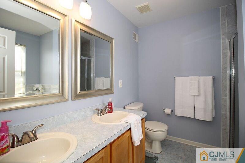 44 Cannon Road Old Bridge, NJ 08857 - Photo 15 of 24 a bathroom with a granite countertop toilet a sink and a mirror